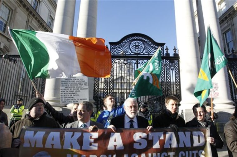 Protesters demonstrate against harsh austerity measures outside Irish government buildings in Dublin Wednesday. Some analysts are openly questioning the euro zone's future amid a new wave of financial problems in several countries. 